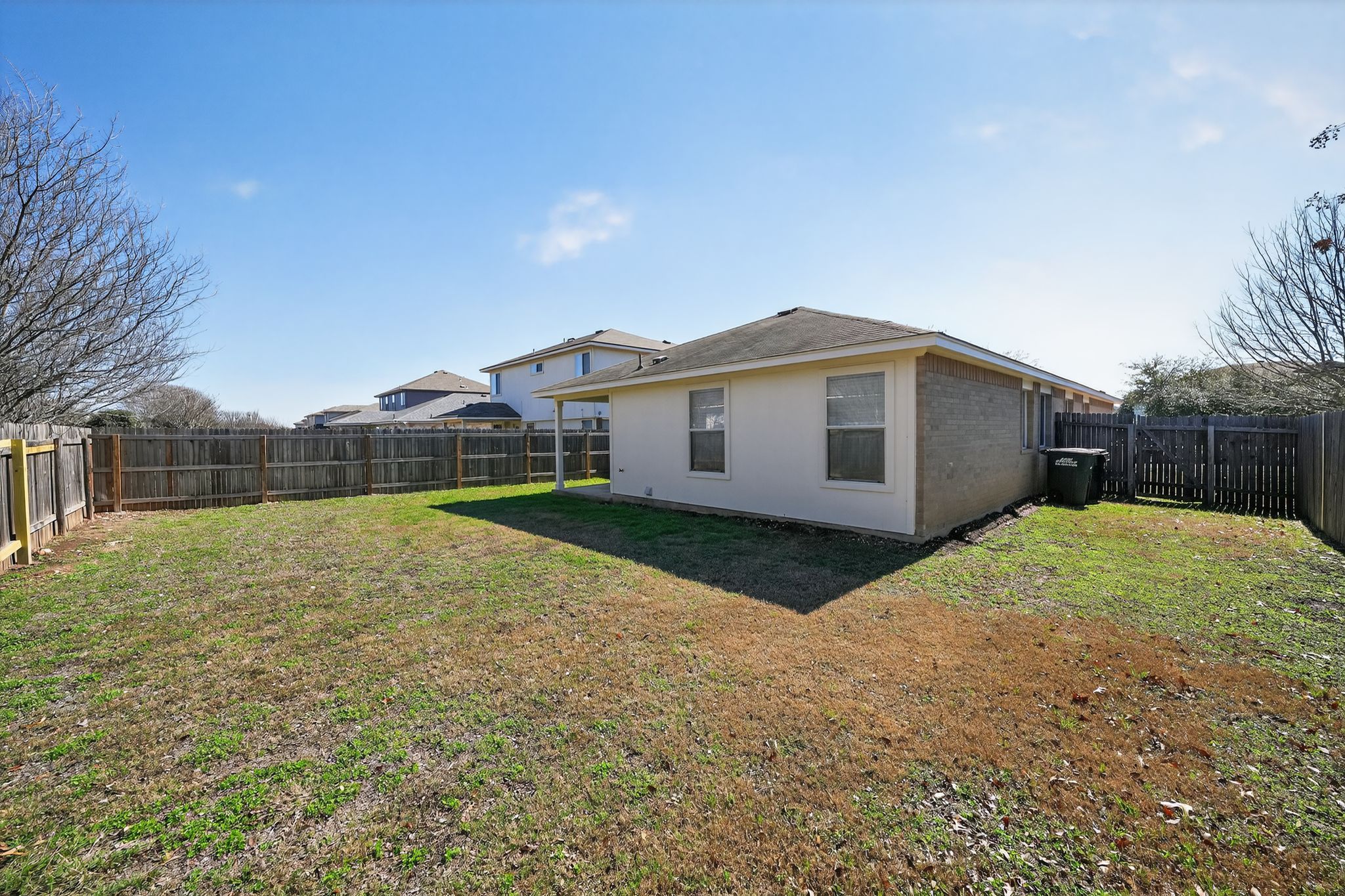 1007 Gentry Drive Leander, TX 78641 - Photo 33 of 35 a view of a house with backyard and trees
