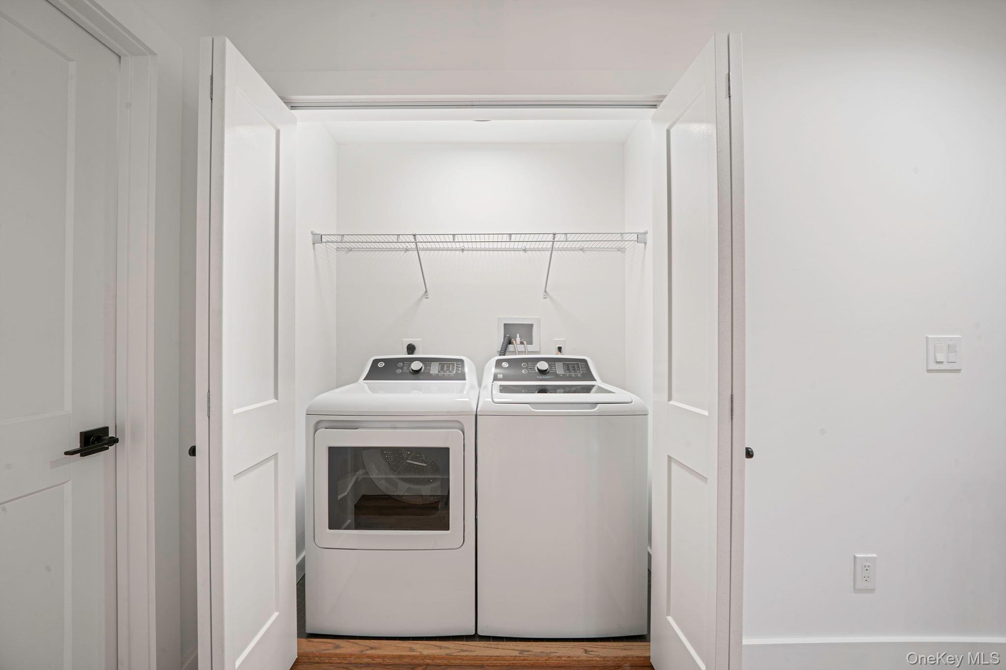 63 C Blydenburgh Road Centereach, NY 11720 - Photo 25 of 38 a utility room with dryer and washer