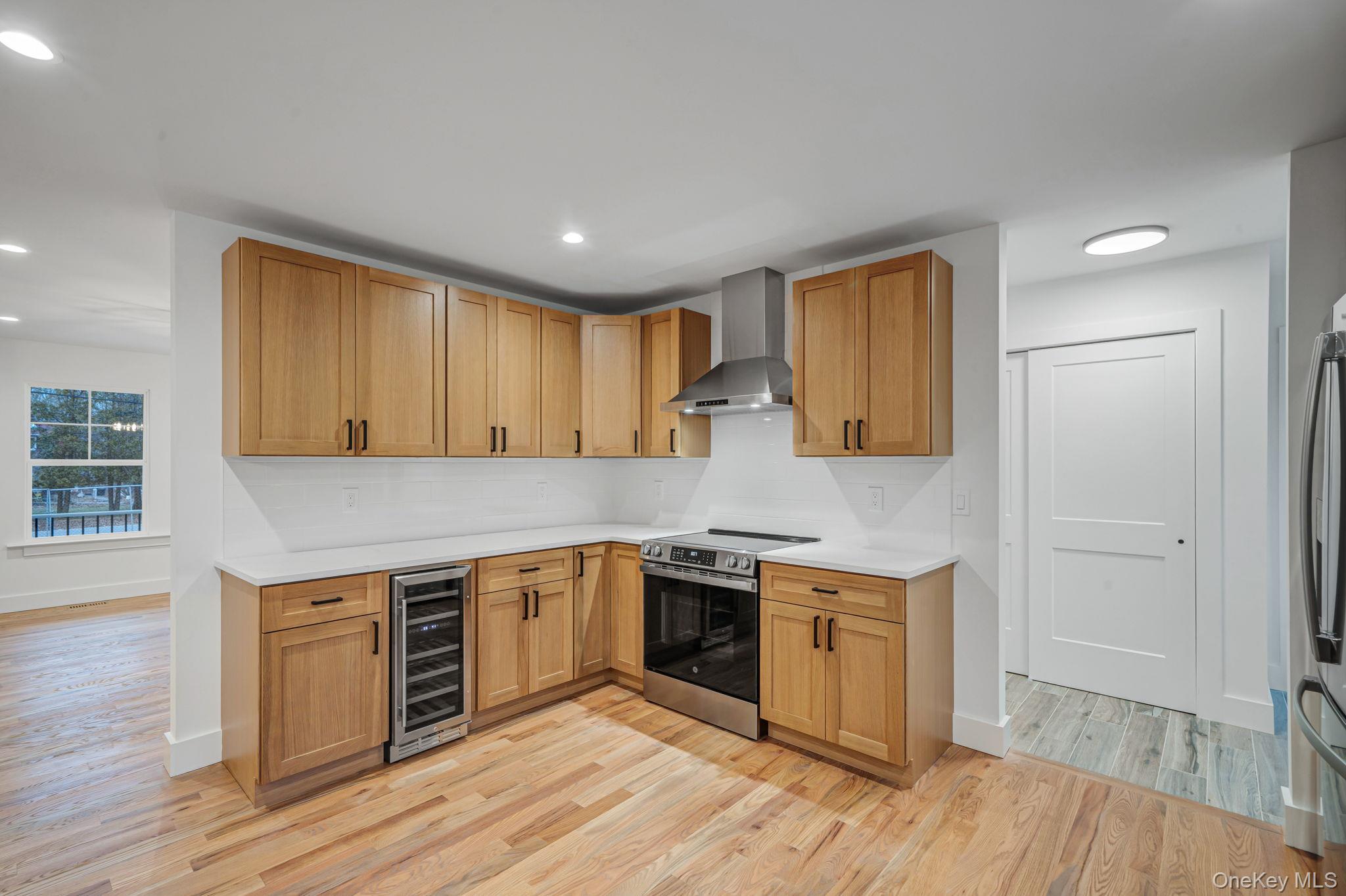 63 C Blydenburgh Road Centereach, NY 11720 - Photo 6 of 38 a kitchen with a stove top oven sink and cabinets