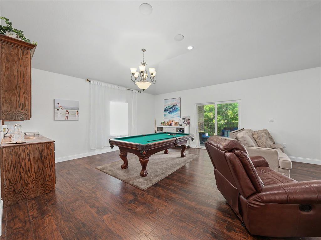 6701 Nauert Road Forest Hill, TX 76140 - Photo 28 of 40 Spacious room with wood-finish flooring, recessed lighting, and a chandelier