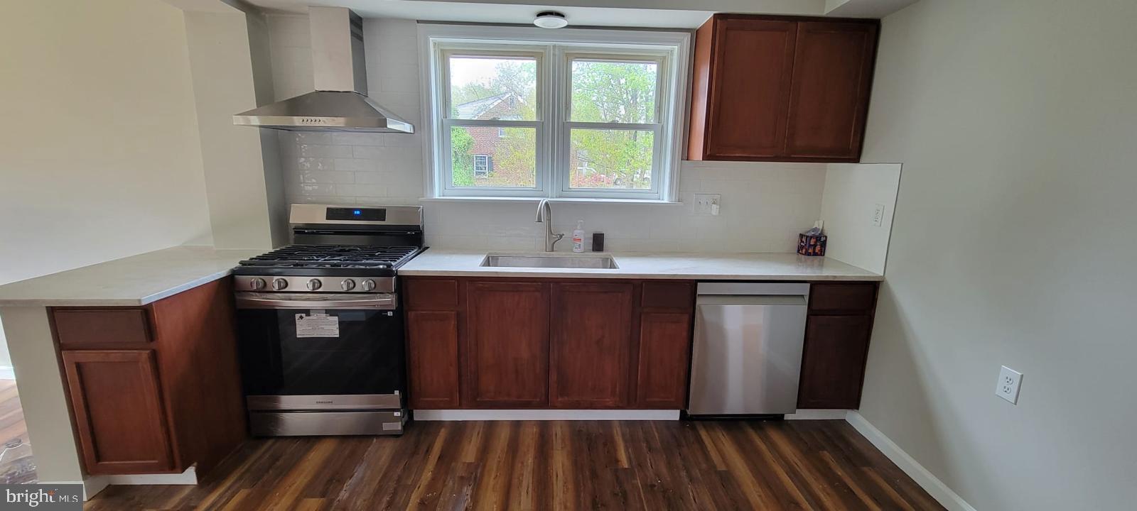 102 Rothwell Drive Wilmington, DE 19804 - Photo 8 of 19 Modern kitchen with warm wood tones.