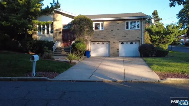 a front view of a house with yard