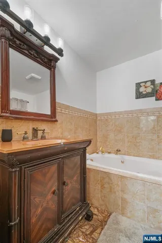 a bedroom with a bed and a mirror