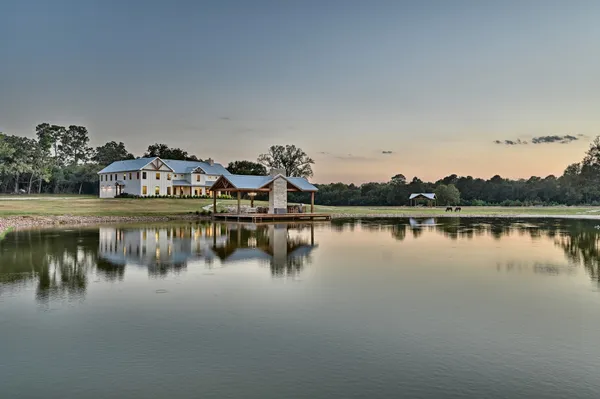 a view of a lake with boats and trees in the background