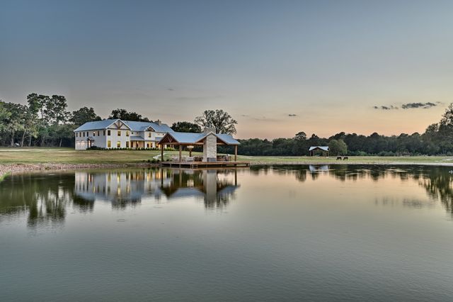 a view of a lake with boats and trees in the background