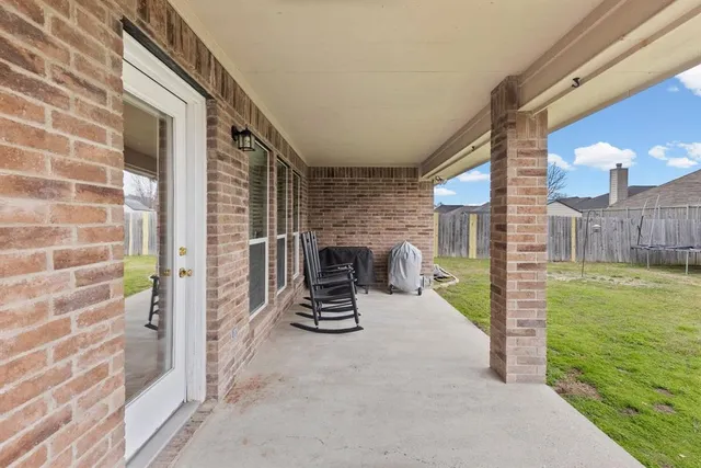 a bathroom with a sink a toilet and shower curtain