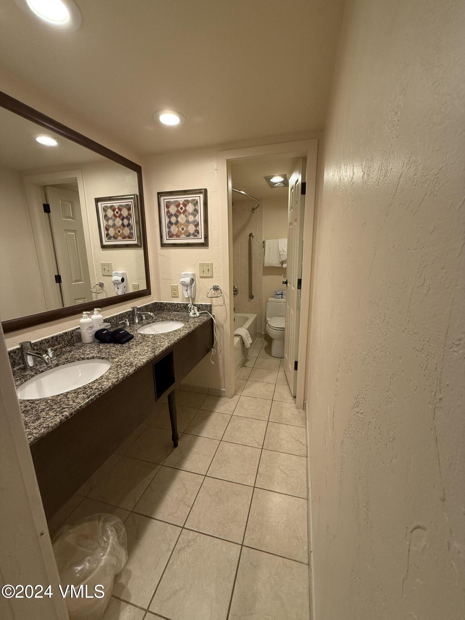 1020 Vail View Drive, Unit 220434 Vail, CO 81657 - Photo 7 of 21 a view of a refrigerator a sink and cabinets