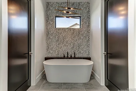 a bathroom with a bathtub and shower