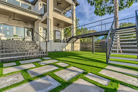 a front view of a house with a yard table and chairs