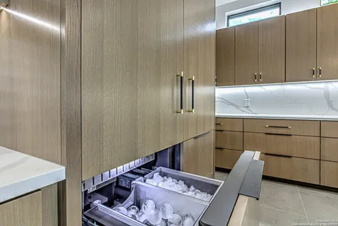 a view of kitchen with cabinets