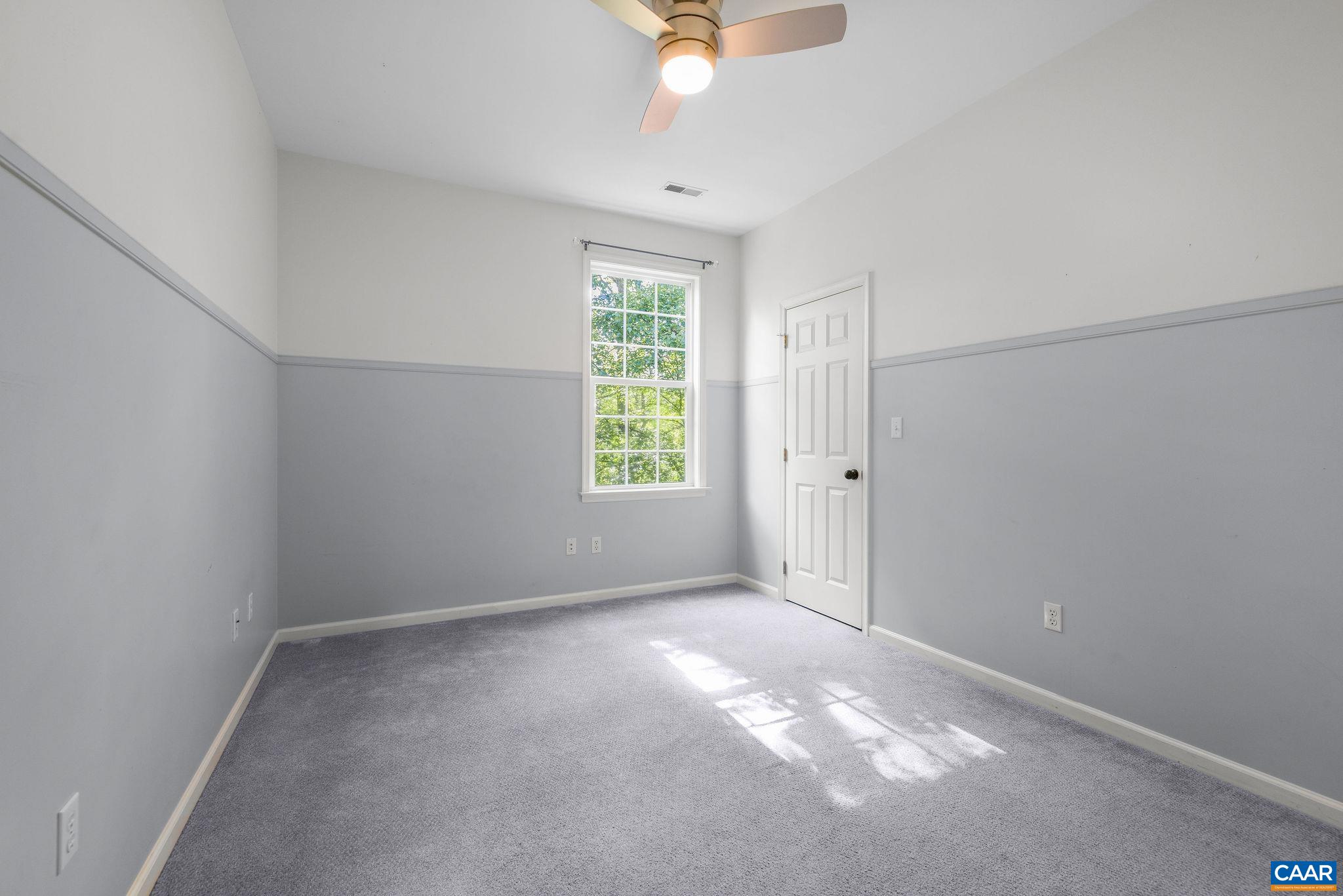 3591 Garth Road Charlottesville, VA 22901 - Photo 35 of 61 an empty room with a window and a ceiling fan