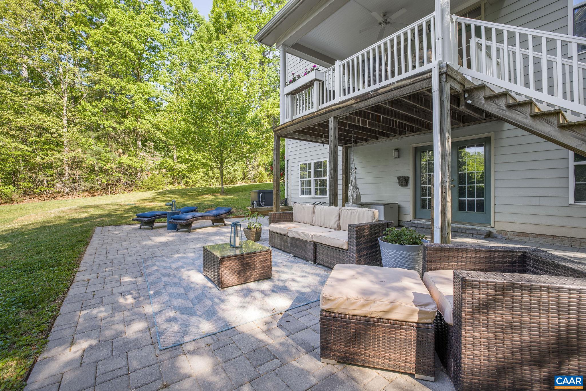 3591 Garth Road Charlottesville, VA 22901 - Photo 46 of 61 a view of a patio with couches table and chairs and potted plants