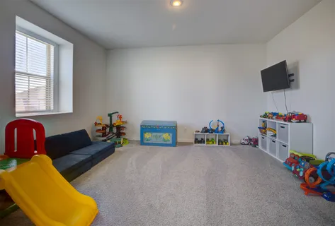 a children room with toys and a couch