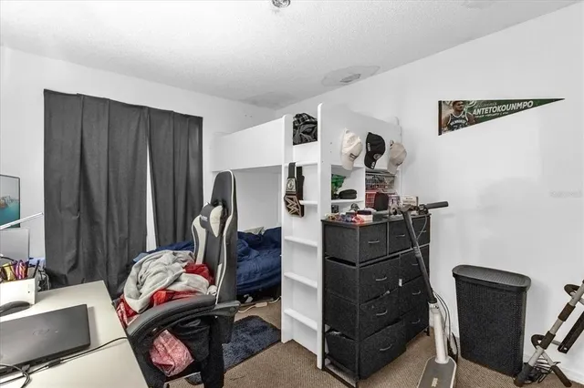 a room with a couch and a dresser