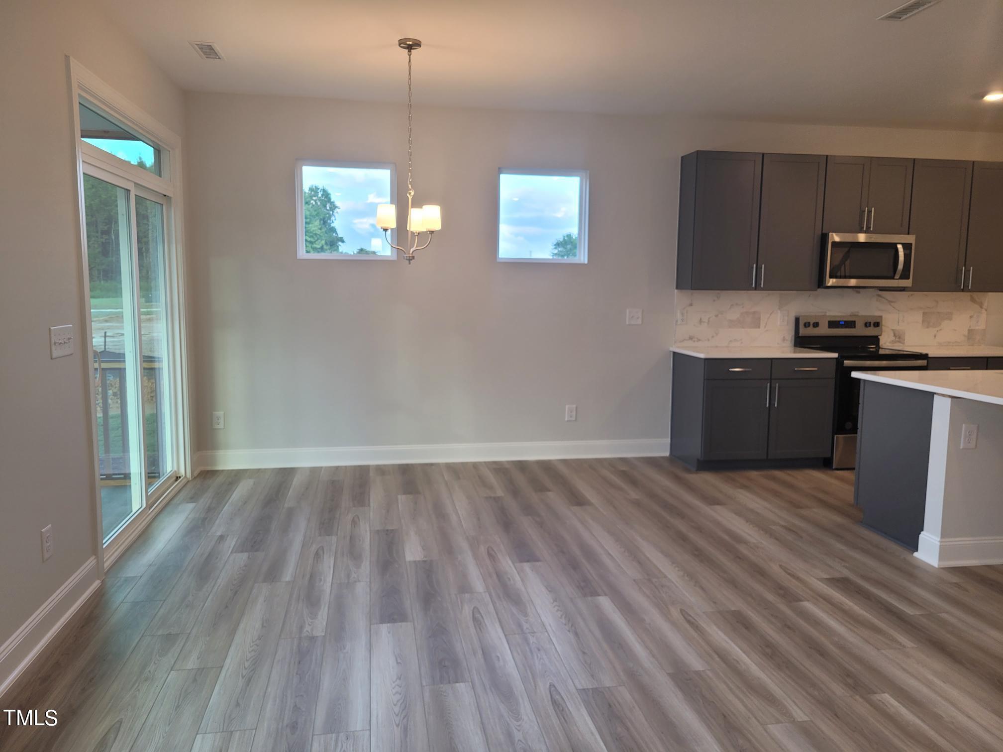 3611 Tarmac Road West Wilson, NC 27896 - Photo 14 of 28 a view of kitchen and wooden floor