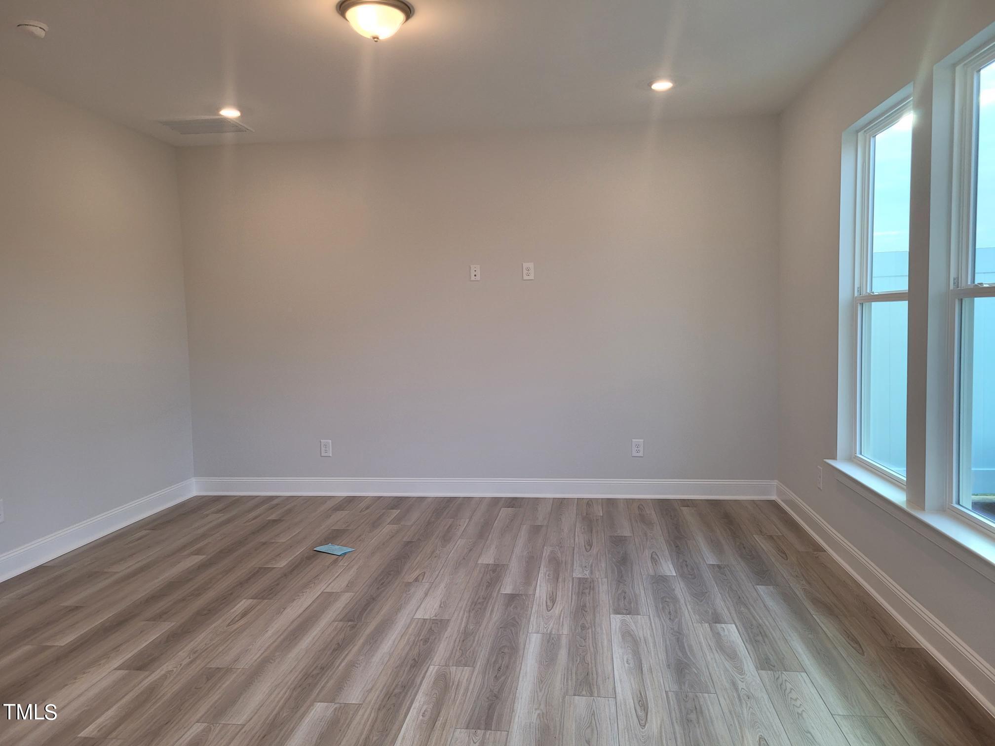 3611 Tarmac Road West Wilson, NC 27896 - Photo 15 of 28 a view of room with window and hardwood floor