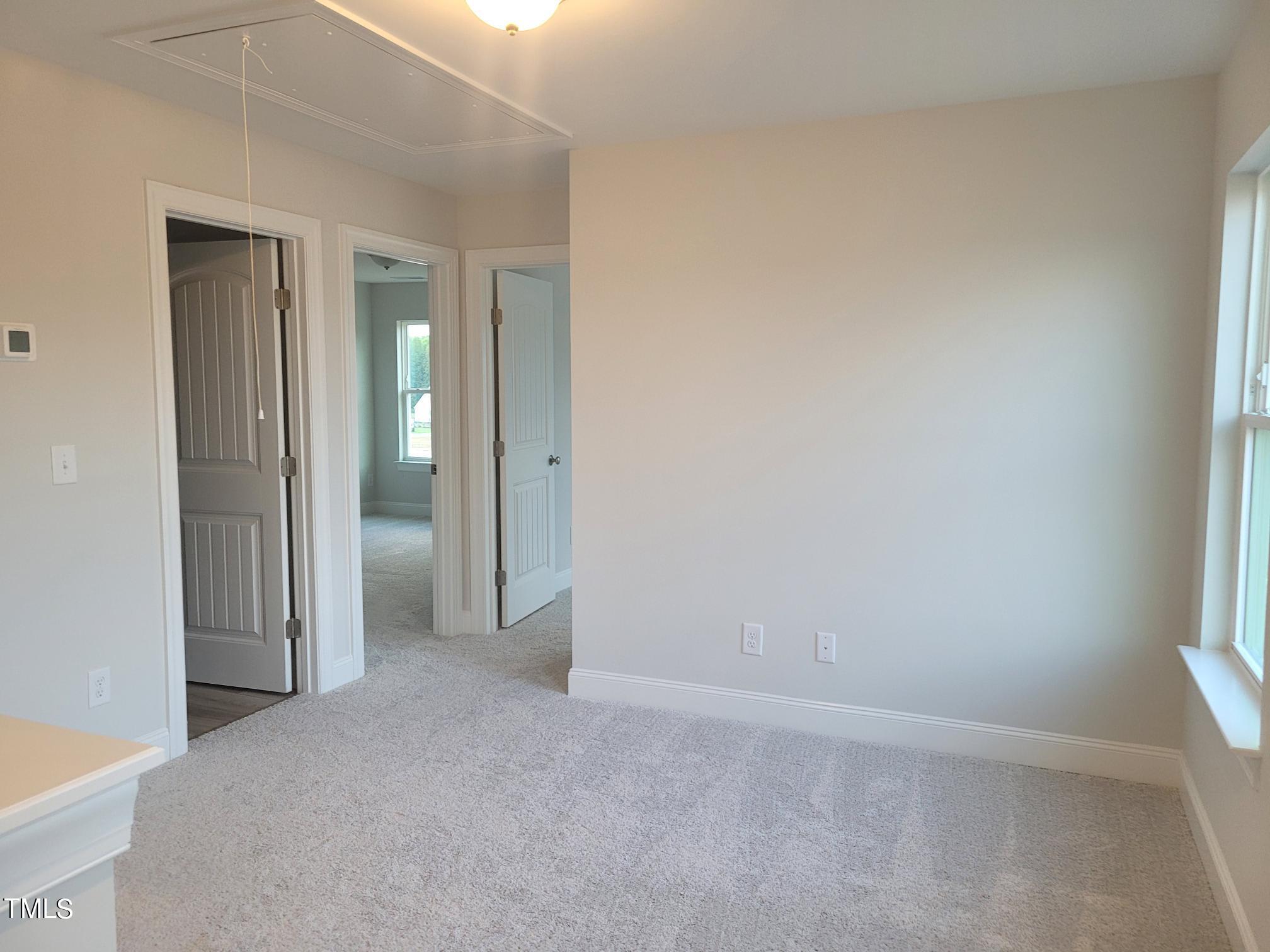 3611 Tarmac Road West Wilson, NC 27896 - Photo 17 of 28 an empty room with window in back and closet area