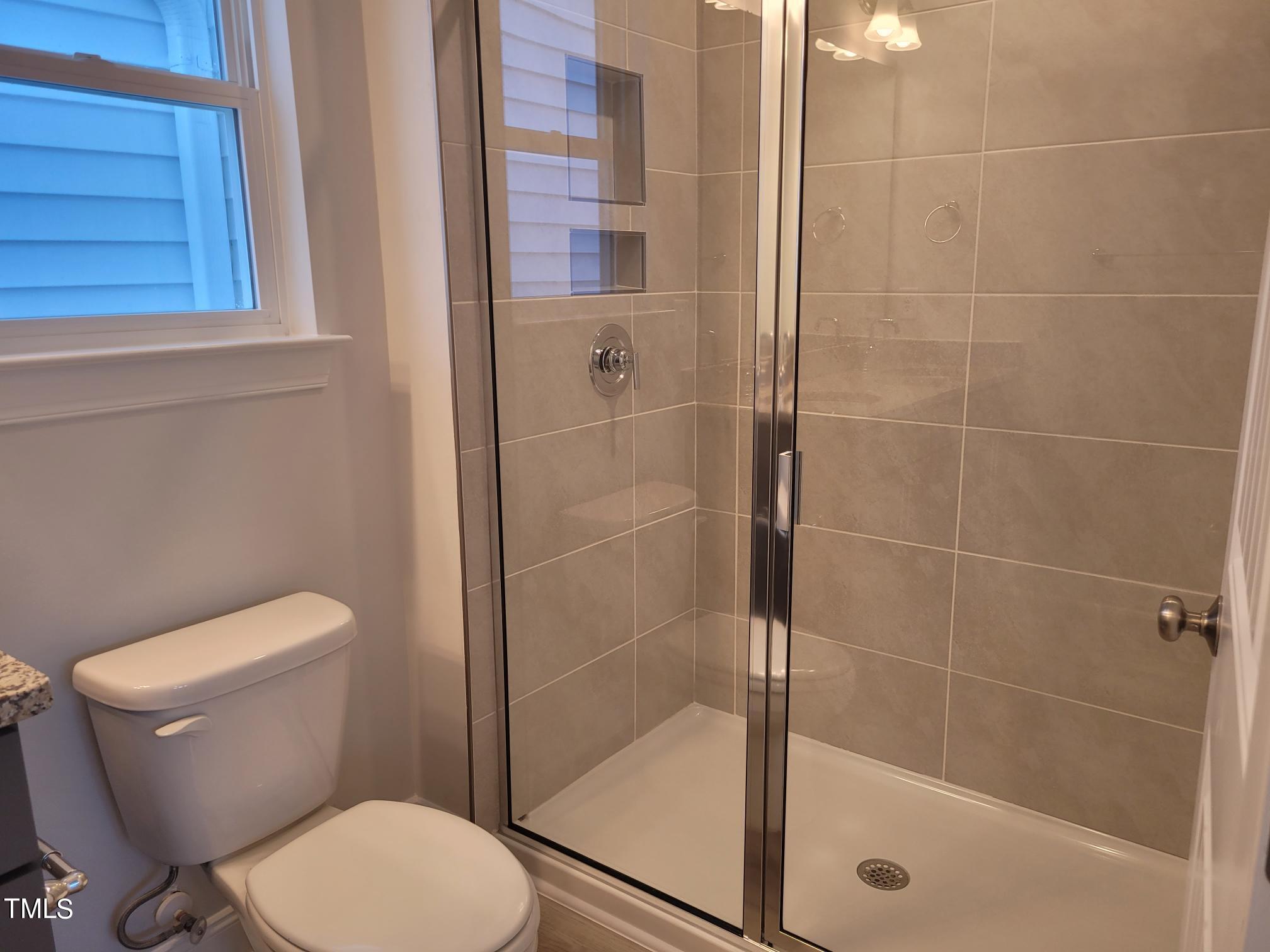 3611 Tarmac Road West Wilson, NC 27896 - Photo 25 of 28 a bathroom with a toilet and shower