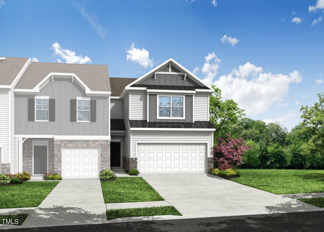 3611 Tarmac Road West Wilson, NC 27896 - Photo 3 of 28 a front view of a house with a yard and garage