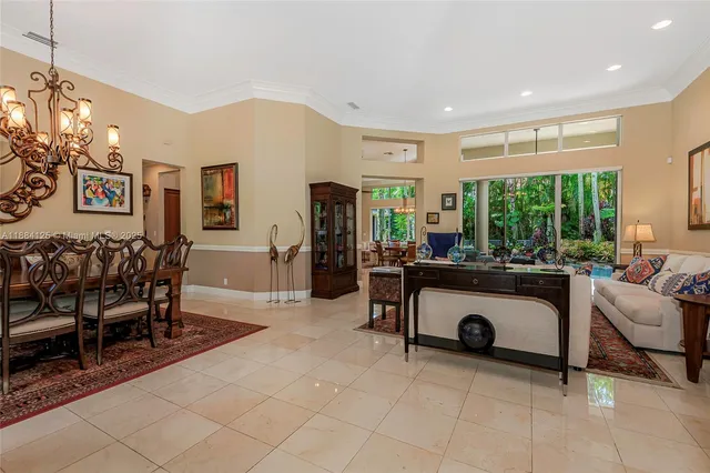 a kitchen with stainless steel appliances granite countertop a sink refrigerator and cabinets