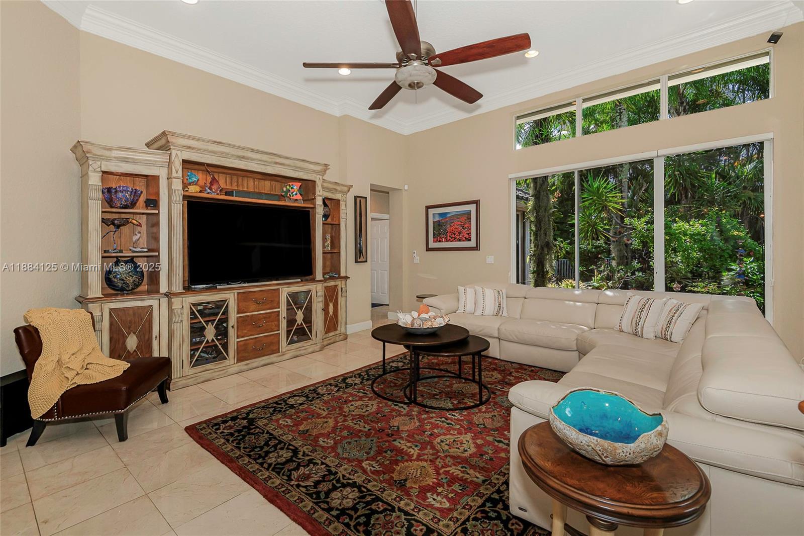 1100 Southwest 156th Avenue Pembroke Pines, FL 33027 - Photo 35 of 86 a living room with furniture and a flat screen tv