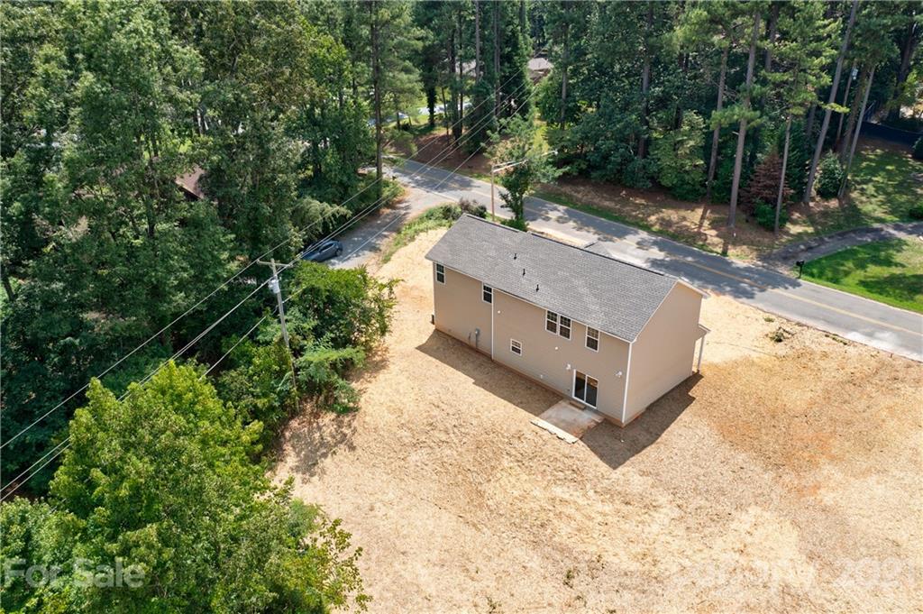 1720 Love Road Monroe, NC 28110 - Photo 5 of 48 a green field with trees in the background