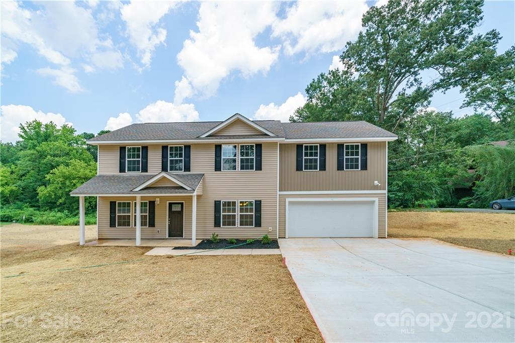 1720 Love Road Monroe, NC 28110 - Photo 42 of 48 a front view of a house with yard