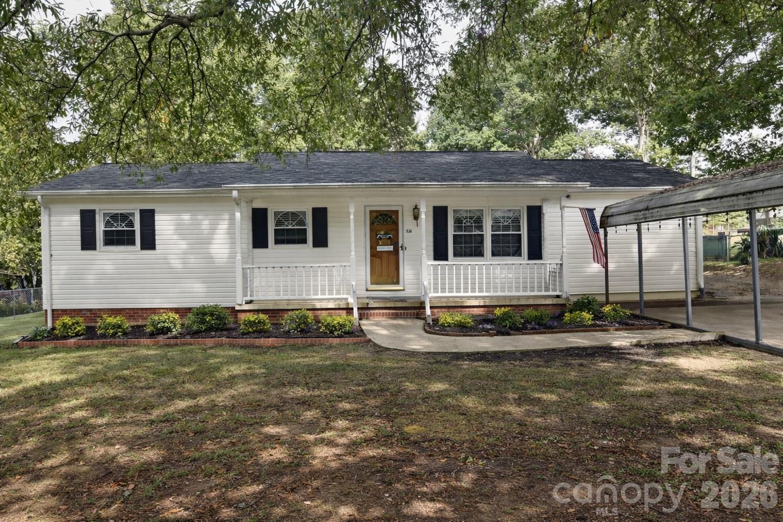 130 Happy Hollow Road, Unit 13/B Rockwell, NC 28138 - Photo 1 of 17 a view of a house with a yard