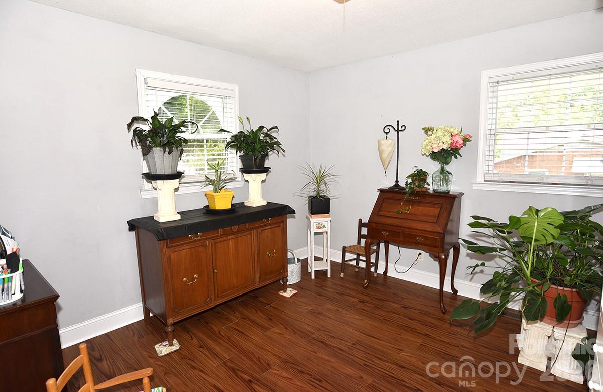 130 Happy Hollow Road, Unit 13/B Rockwell, NC 28138 - Photo 13 of 17 a living room with furniture and a potted plant