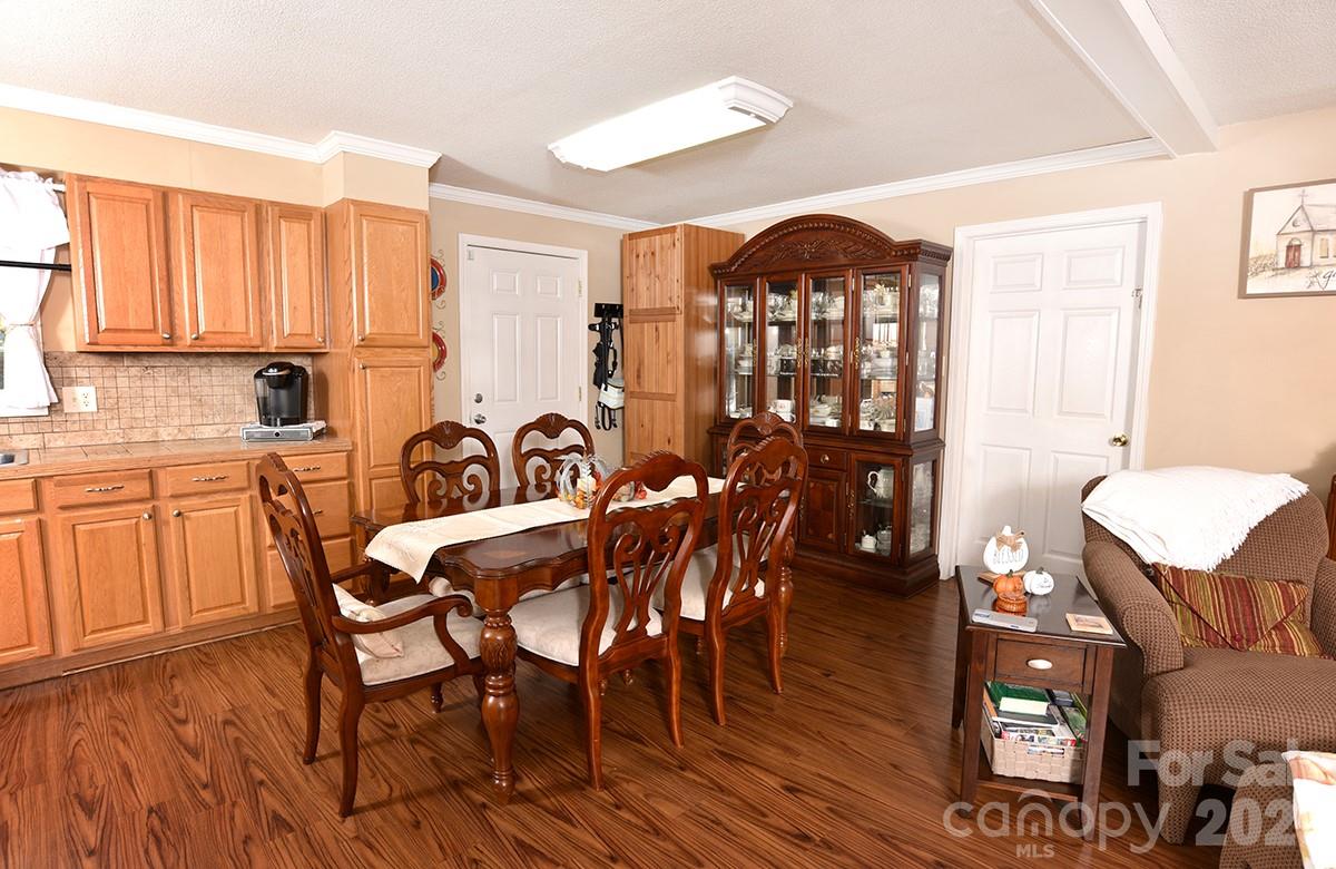 130 Happy Hollow Road, Unit 13/B Rockwell, NC 28138 - Photo 6 of 17 a view of a a dining room with furniture window and wooden floor