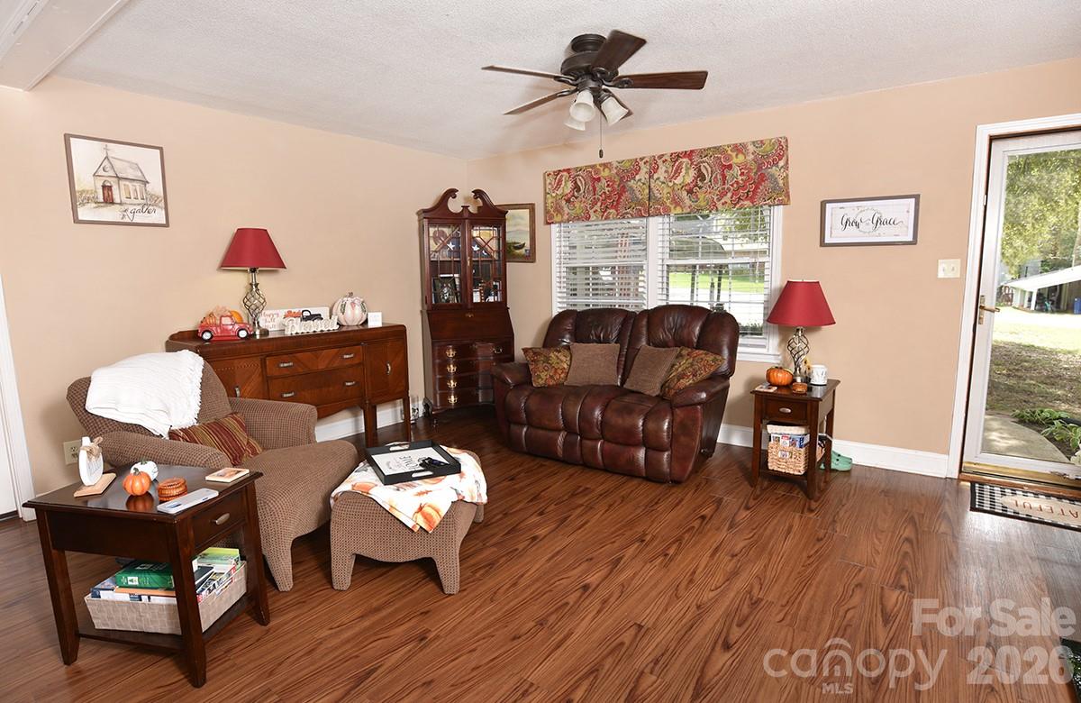 130 Happy Hollow Road, Unit 13/B Rockwell, NC 28138 - Photo 7 of 17 a living room with furniture and wooden floor