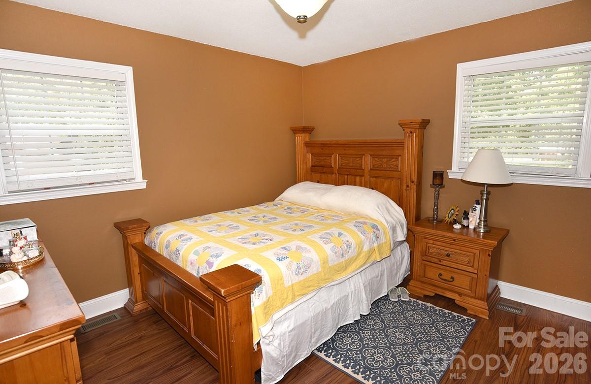 130 Happy Hollow Road, Unit 13/B Rockwell, NC 28138 - Photo 10 of 17 a bed sitting in a bedroom next to a window