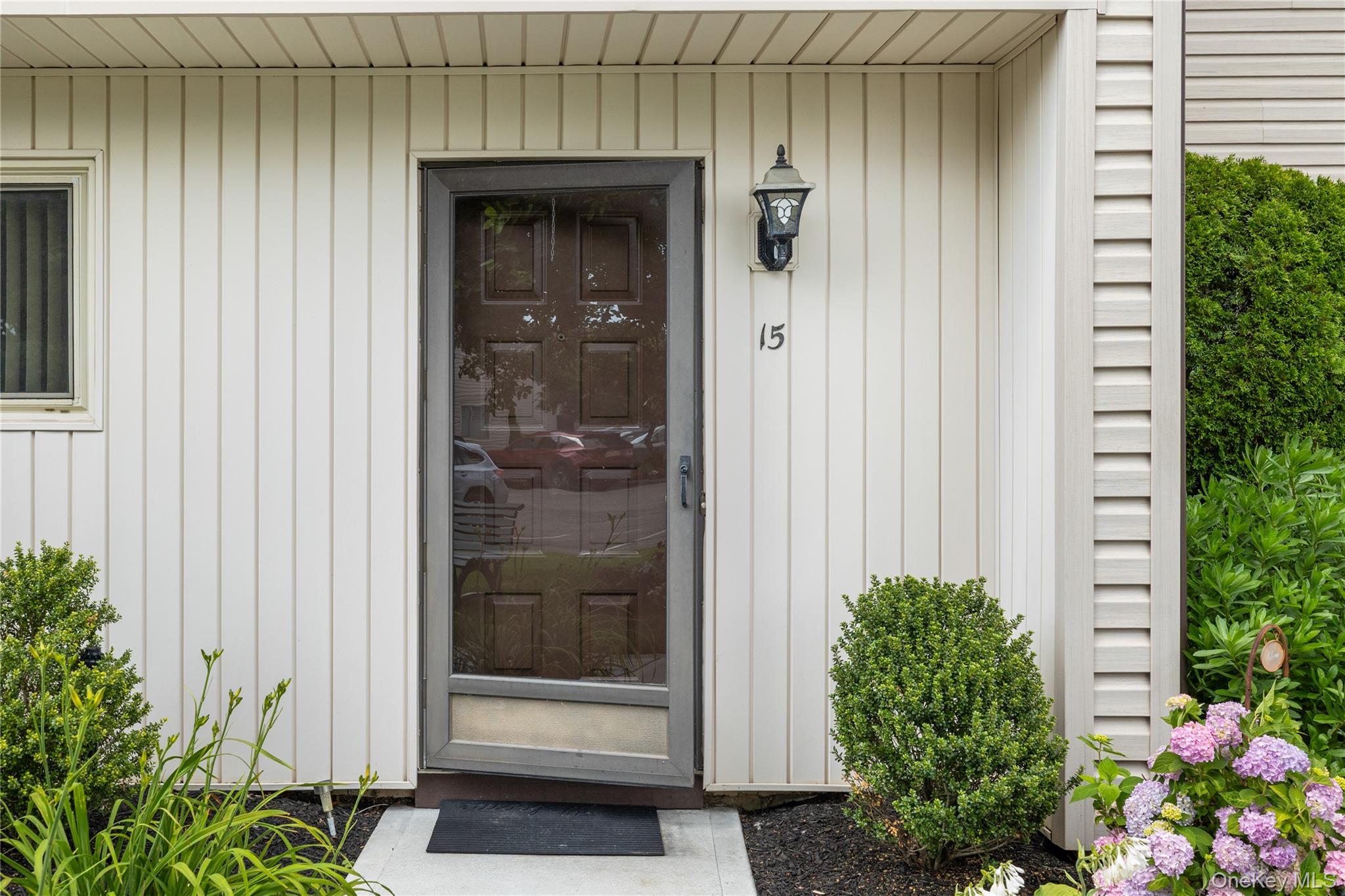 650 Newbridge Road, Unit 15 East Meadow, NY 11554 - Photo 1 of 20 a view of a door and a window