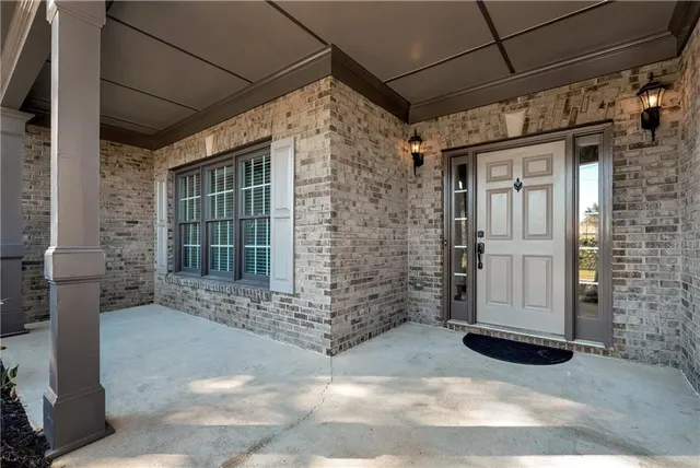 a view of wooden floor and chandelier in a room