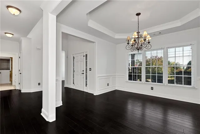 a kitchen with stainless steel appliances granite countertop a stove a sink dishwasher a refrigerator and a oven with wooden floor