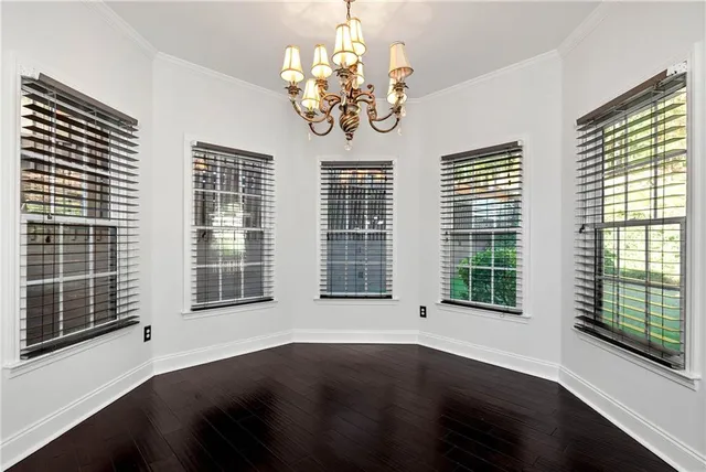 a view of an empty room with a ceiling fan