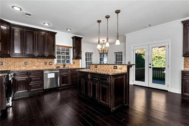 a spacious bathroom with a tub sink shower and mirror