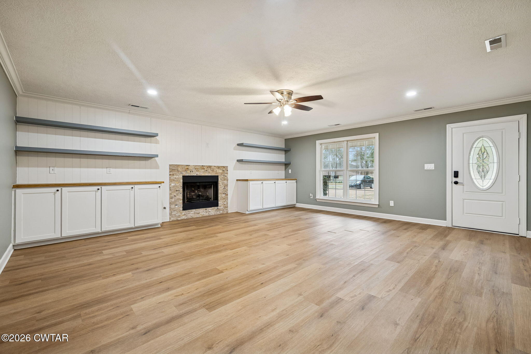 123 Walnut Hill Road Bells, TN 38006 - Photo 11 of 61 an empty room with wooden floor and windows