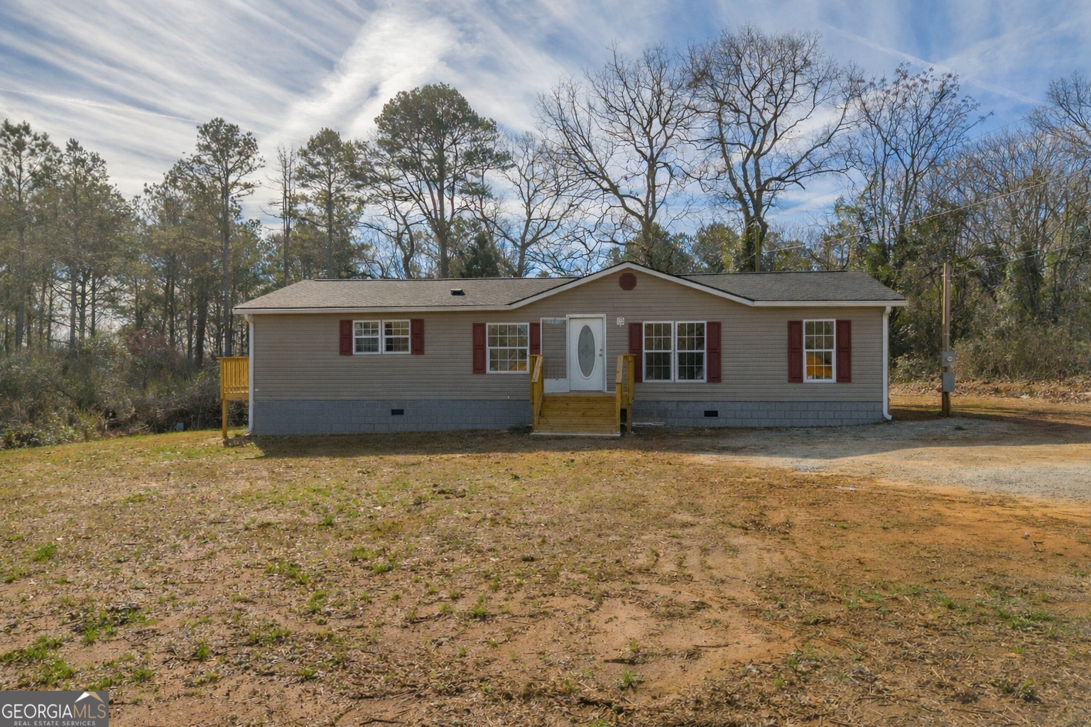 a house with trees in the background