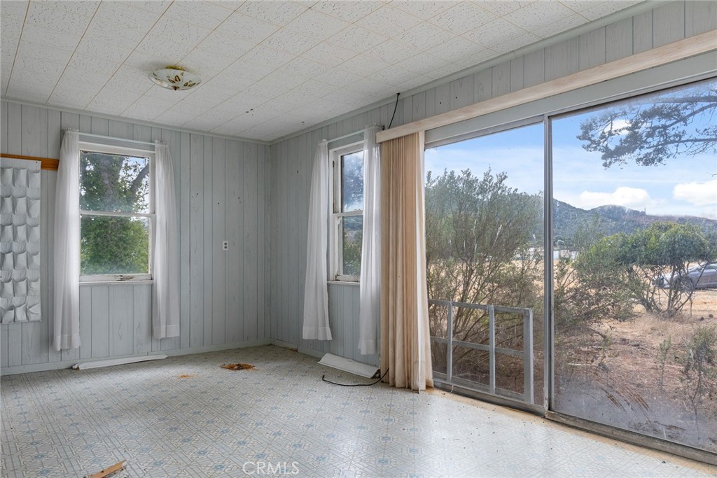2645 Adobe Road Morro Bay, CA 93442 - Photo 11 of 28 a view of an empty room with wooden floor and a window