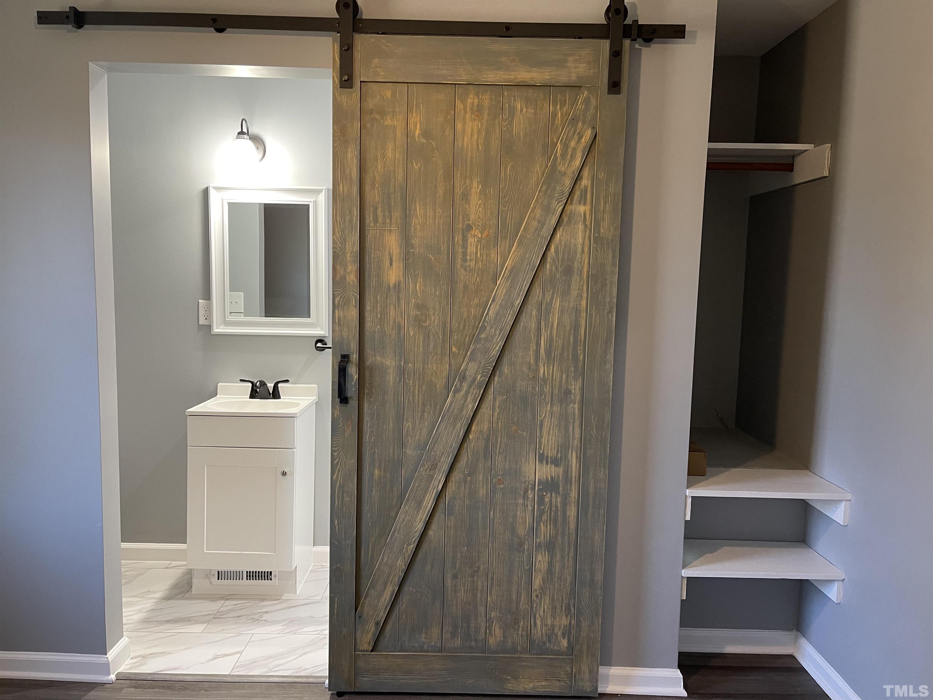 5425 Louisburg Road Raleigh, NC 27616 - Photo 11 of 15 a view of a hallway with wooden floor and entryway