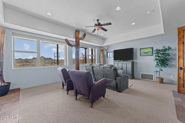 a bathroom with a granite countertop sink a mirror and shower