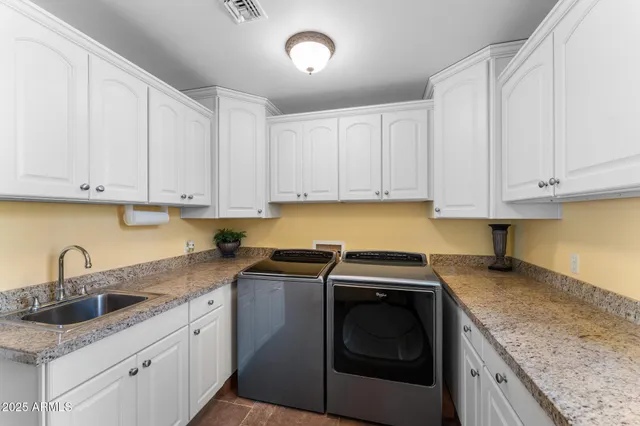a bathroom with a sink a mirror and a shower