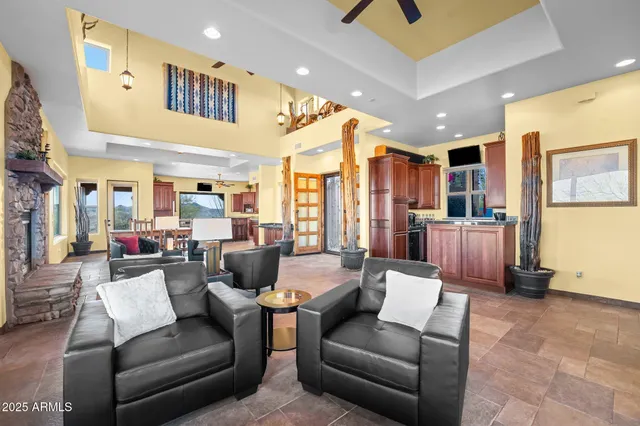 a kitchen with granite countertop stainless steel appliances a refrigerator and a sink