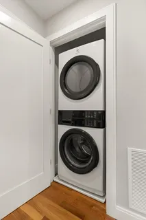 a view of a storage and utility room with a washer and dryer