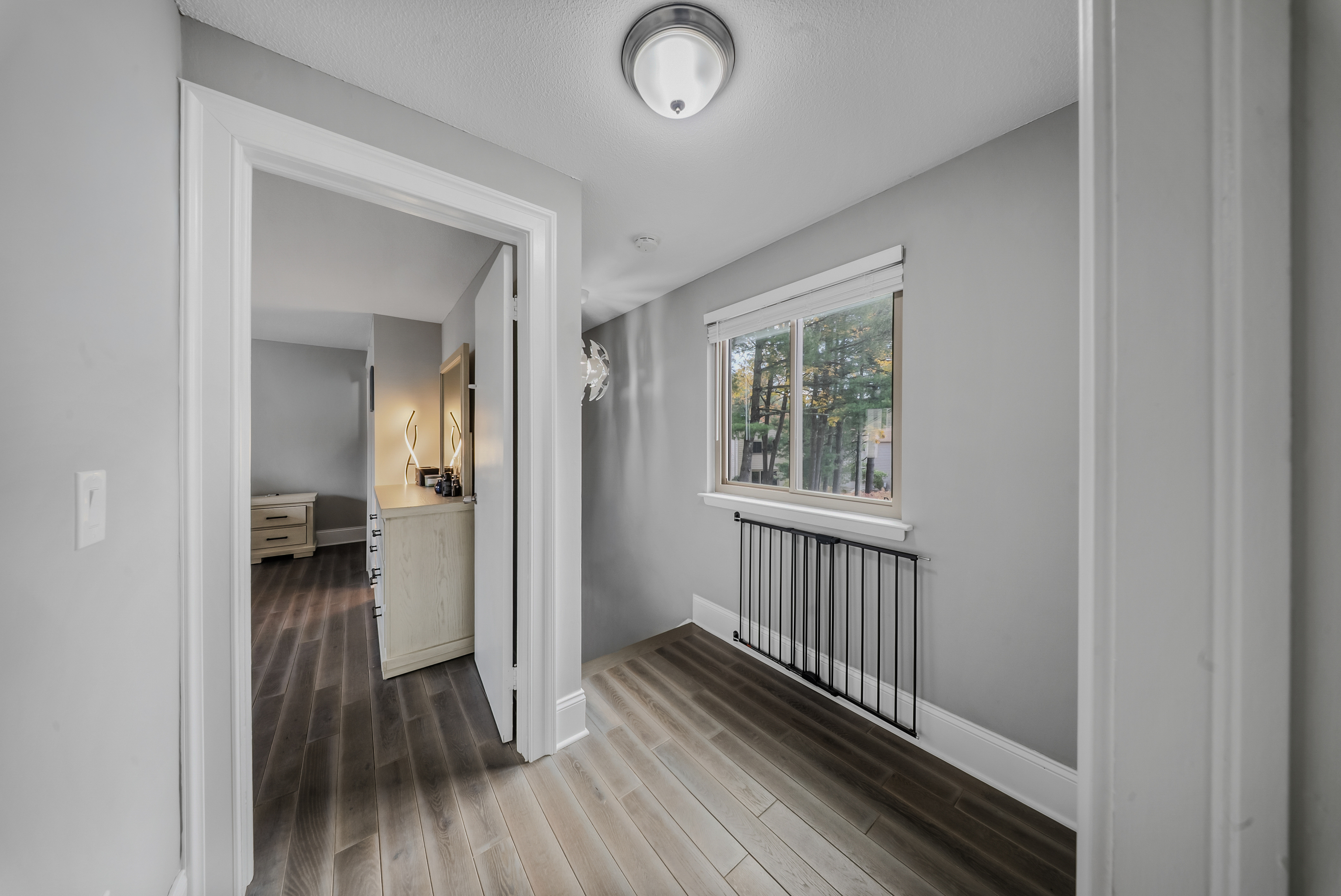 76 River Bend Road, Unit C Stratford, CT 06614 - Photo 11 of 26 a view of a hallway with wooden floor and a bathroom