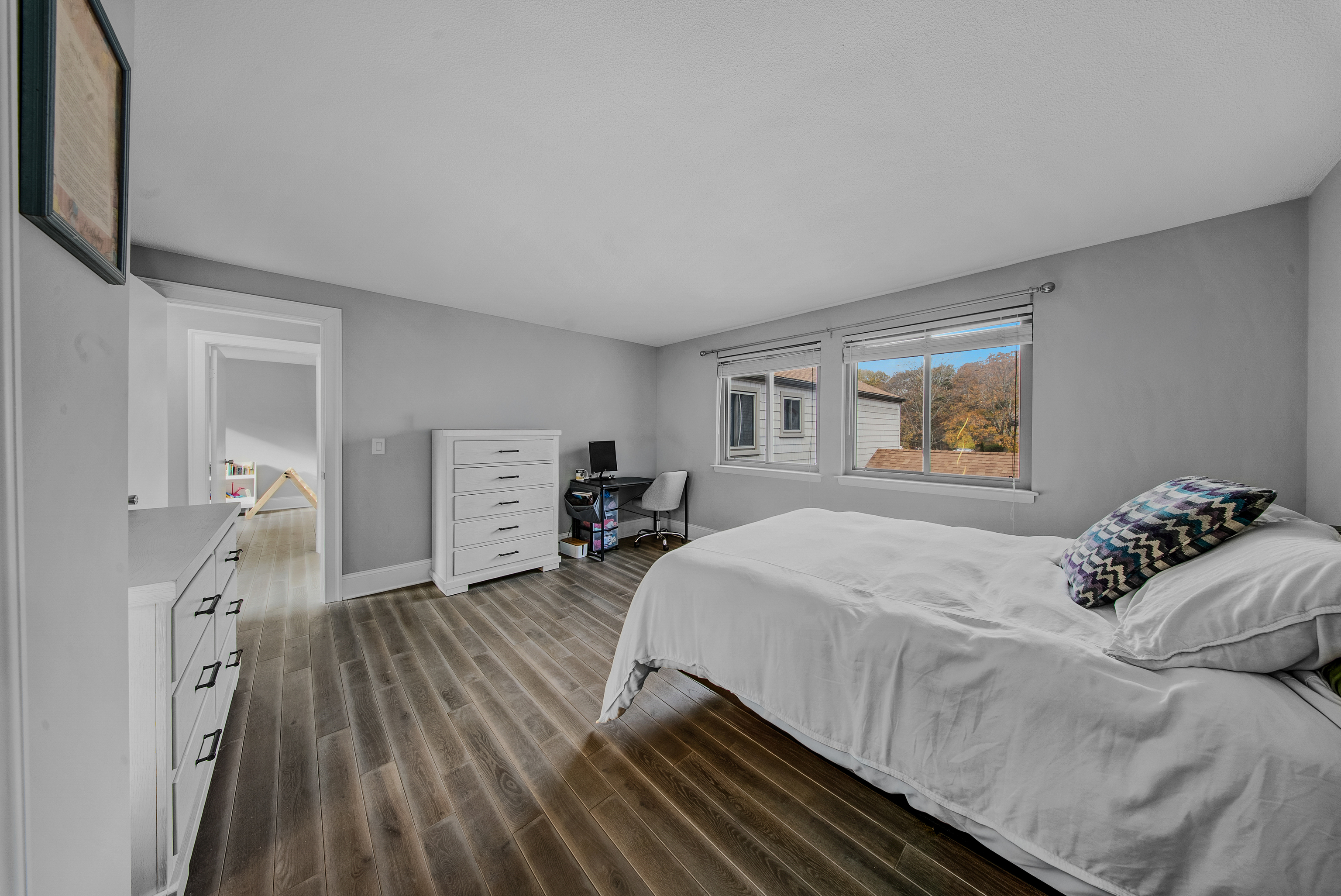 76 River Bend Road, Unit C Stratford, CT 06614 - Photo 13 of 26 a bedroom with a bed and a view of kitchen