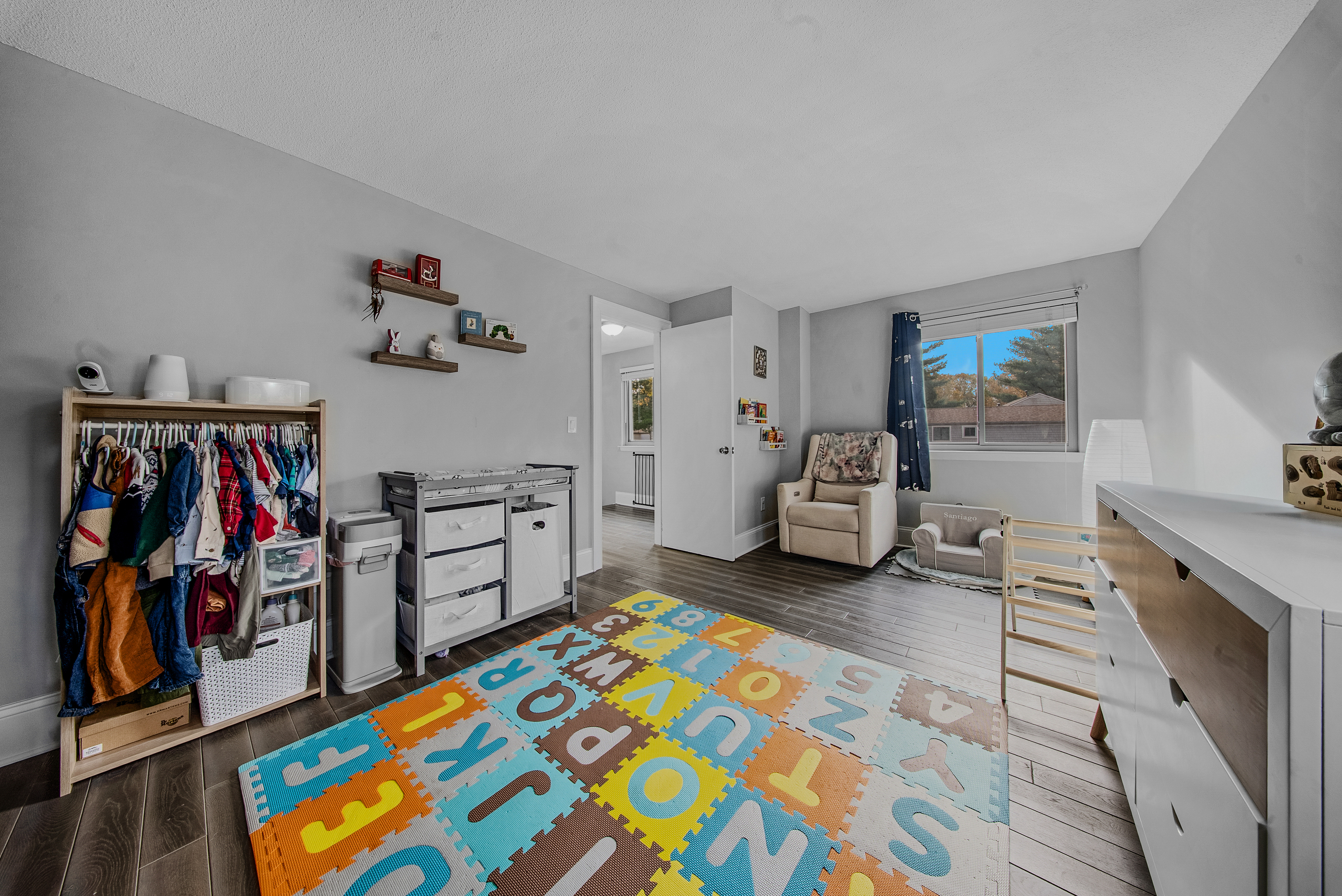 76 River Bend Road, Unit C Stratford, CT 06614 - Photo 16 of 26 a bedroom with furniture and a book shelf