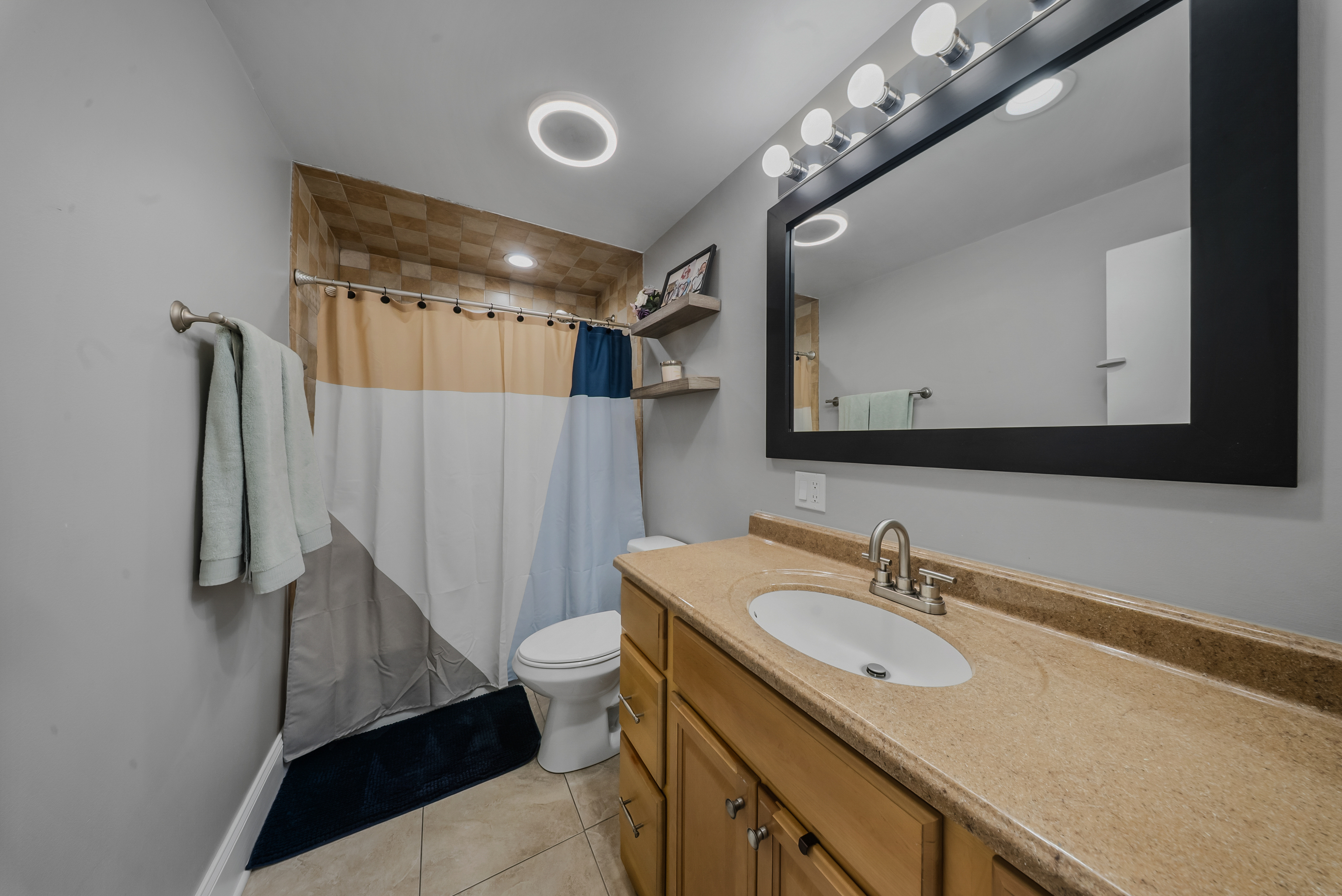 76 River Bend Road, Unit C Stratford, CT 06614 - Photo 17 of 26 a bathroom with a sink double vanity and a mirror