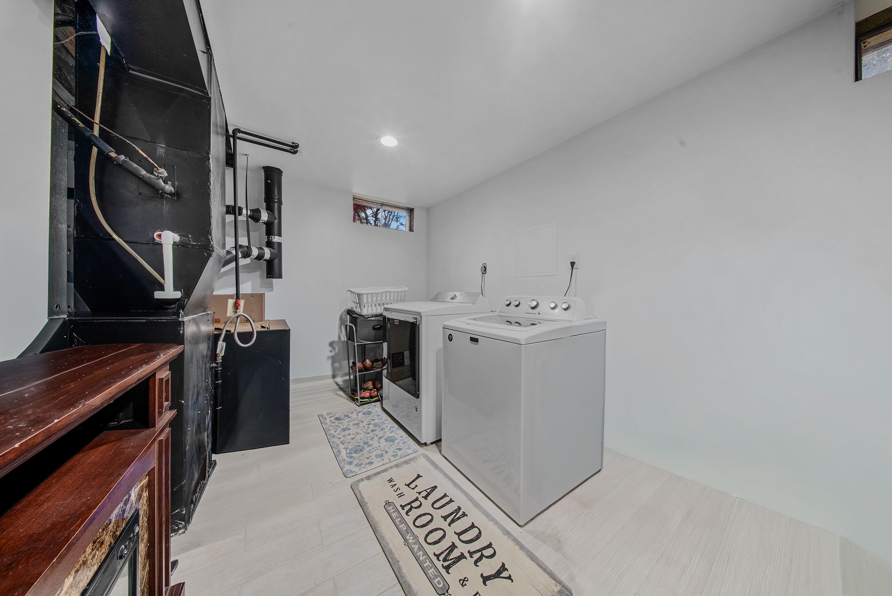 76 River Bend Road, Unit C Stratford, CT 06614 - Photo 19 of 26 a utility room with cabinets dryer and washer